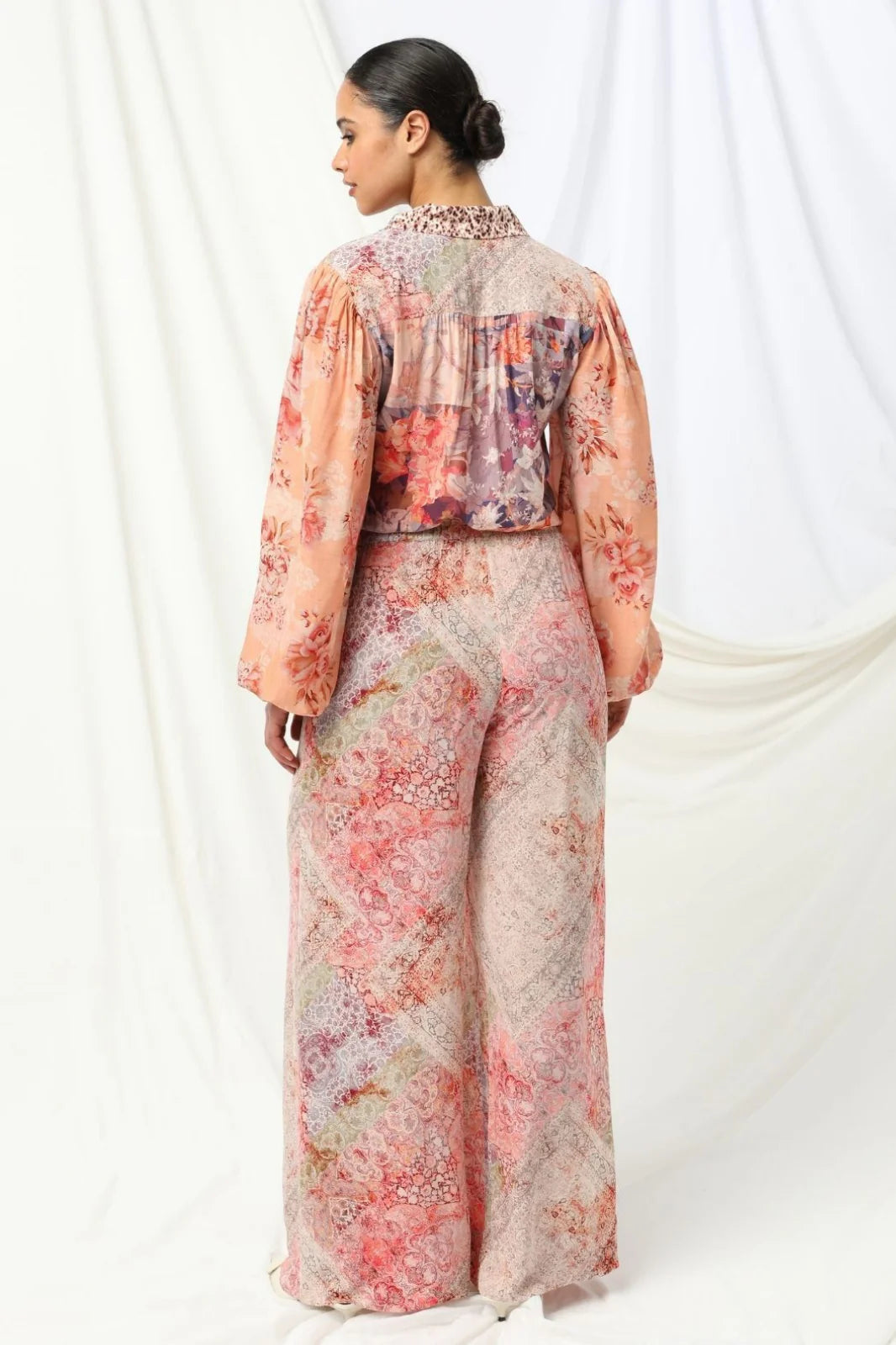 the kachel selena pant in pink is a stylish wide-leg pant in a viscose fabric in a beaituful patchwork print in warm feminine tones