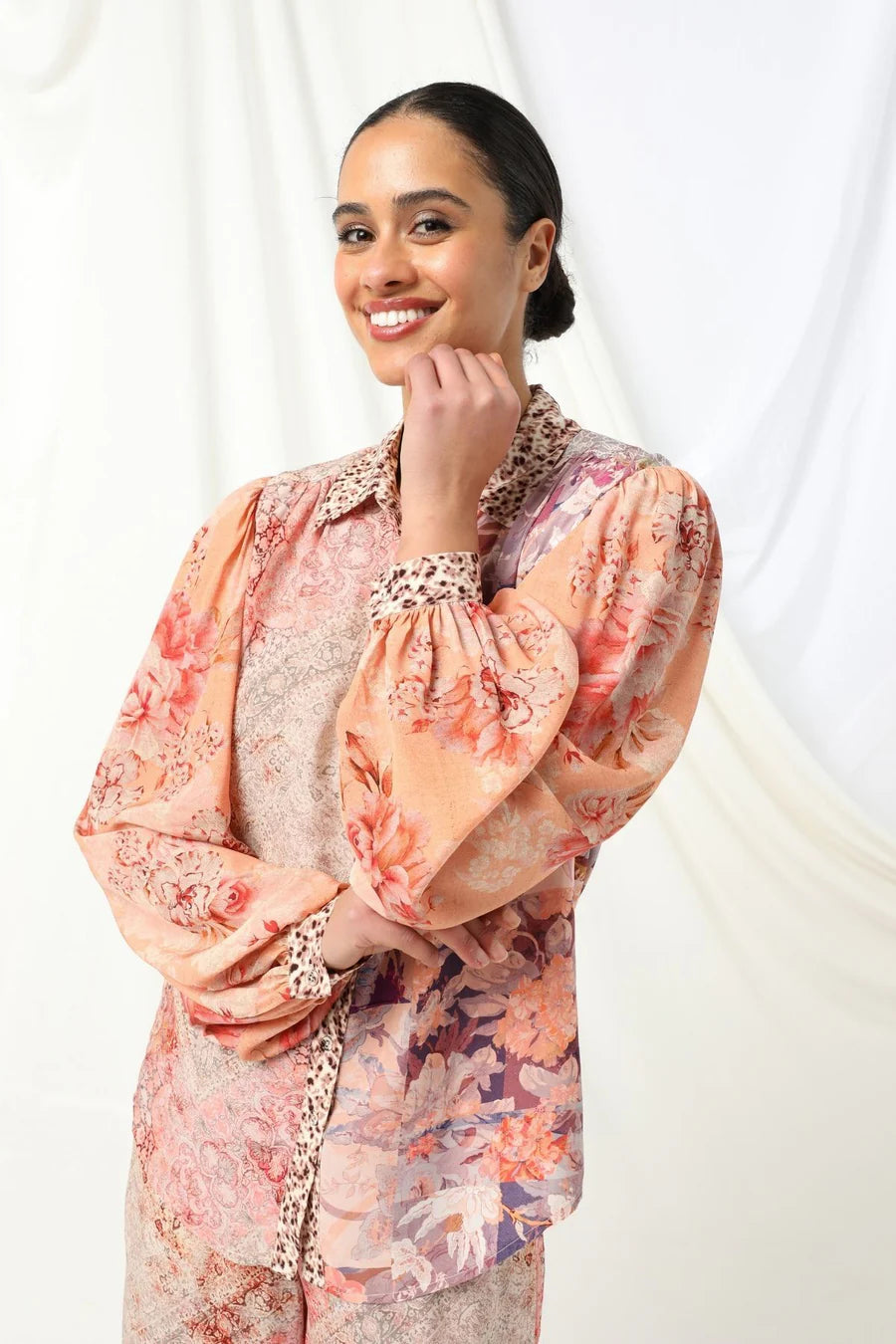the kachel lorelai shirt feautres a floral print with soft animal print tones in soft pink with a feminine touch.