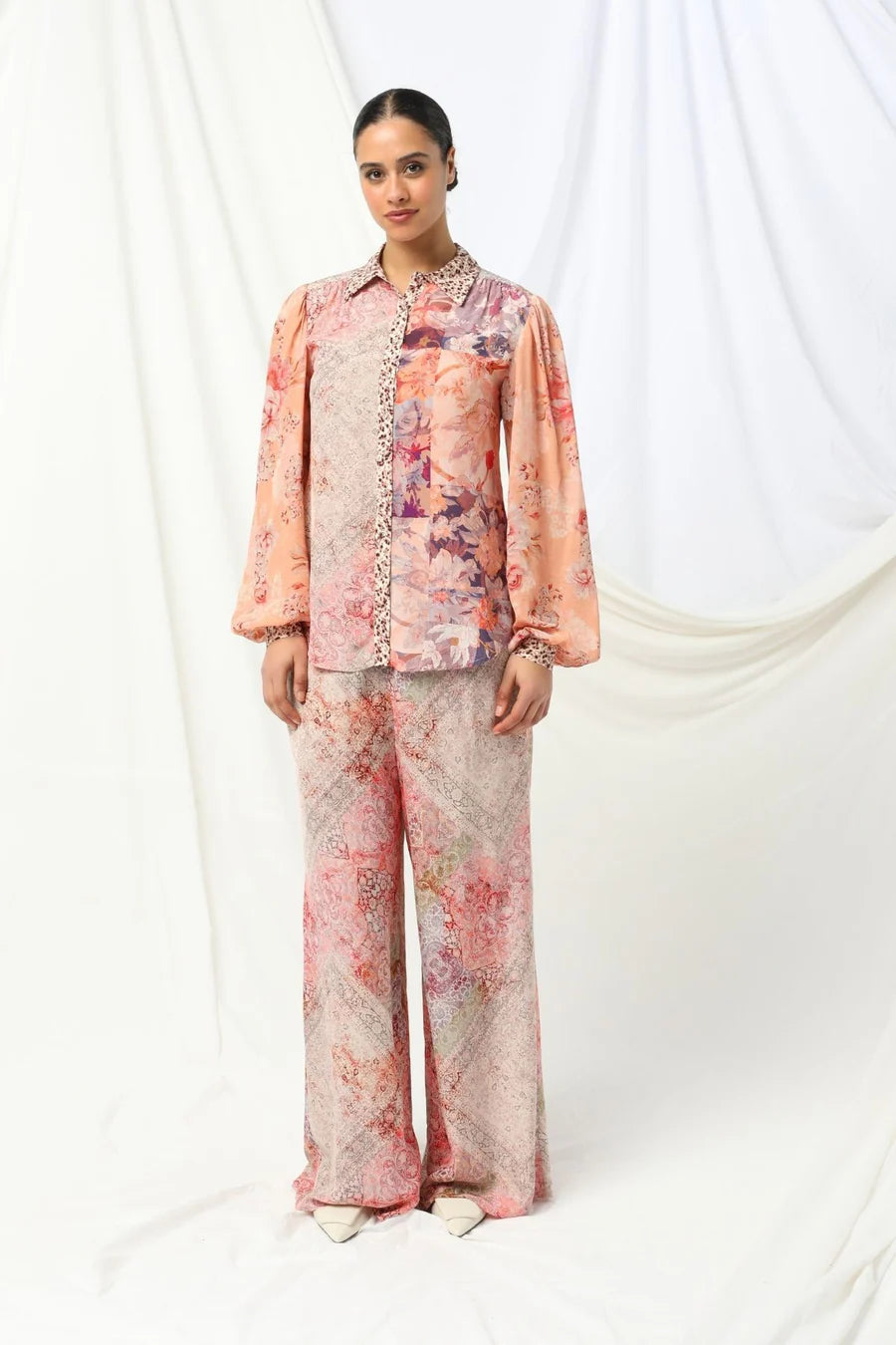 the kachel lorelai shirt feautres a floral print with soft animal print tones in soft pink with a feminine touch.
