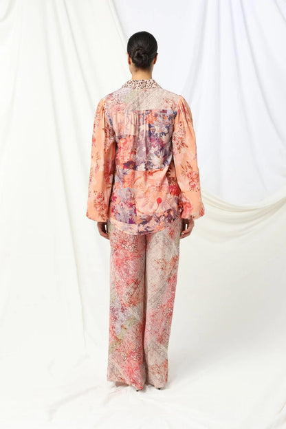 the kachel lorelai shirt feautres a floral print with soft animal print tones in soft pink with a feminine touch.