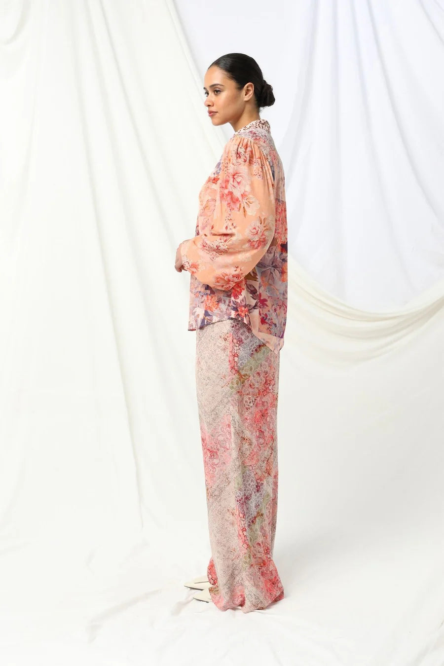 the kachel lorelai shirt feautres a floral print with soft animal print tones in soft pink with a feminine touch.