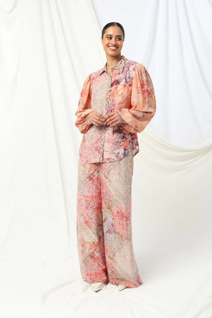 the kachel lorelai shirt feautres a floral print with soft animal print tones in soft pink with a feminine touch.
