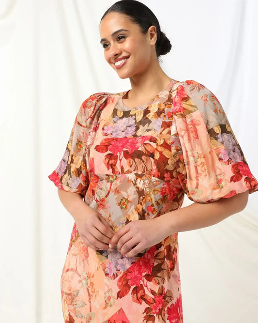 kachel daisy maxi dress is
drenched in vibrant print hues and an elegant floral print and brings a touch sophistication to any event 