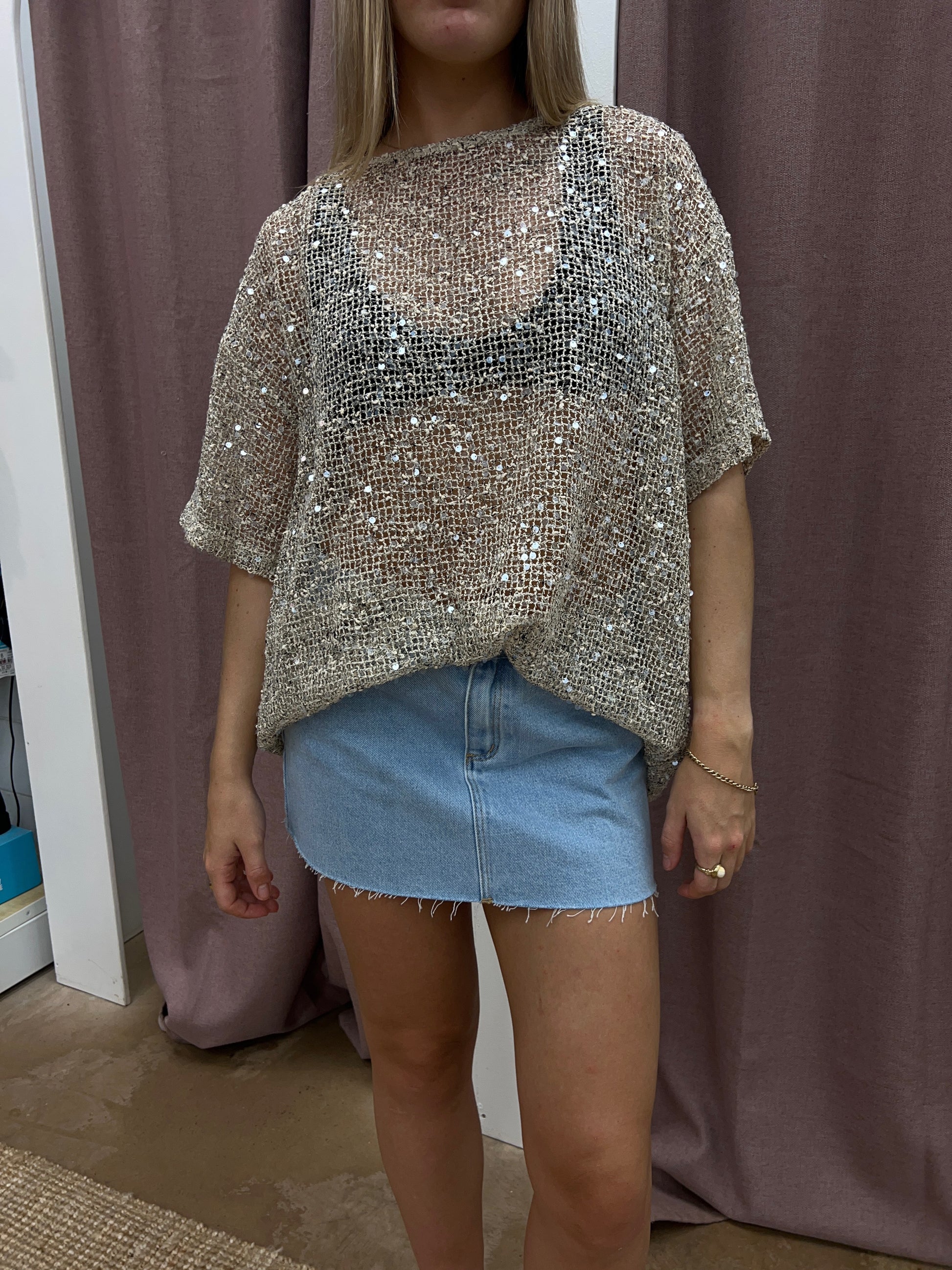 Stand out in this oversized sequin top from By Frankie

Featuring a beige knitted base scattered with shimmering sequins, it instantly adds sparkle to any outfit, whilst also being relaxed and wearable.

Style with any denim during the day or dress it up with tailored pants for that nighttime glow.