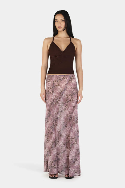 The Erin Top in Chocolate by OWNLEY is a cami top silhouette. Designed in a flattering wrap silhouette, it features light gathering at the side seams, with a twist rope inspired straps. The backless design adds a striking finish, while the front is fully self-lined for support and coverage.