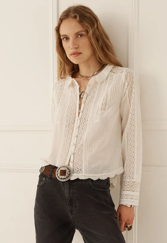 The Prairie Long Sleeve Blouse in Antique White by SPELL, exudes effortless romance with a beautifully artisanal, vintage-inspired spirit. Timeless with a modern twist, this feminine silhouette celebrates intricate lace detailing and the charm of considered craftsmanship.