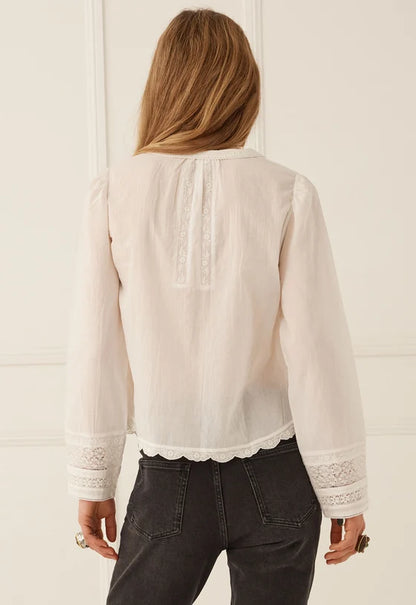 The Prairie Long Sleeve Blouse in Antique White by SPELL, exudes effortless romance with a beautifully artisanal, vintage-inspired spirit. Timeless with a modern twist, this feminine silhouette celebrates intricate lace detailing and the charm of considered craftsmanship.