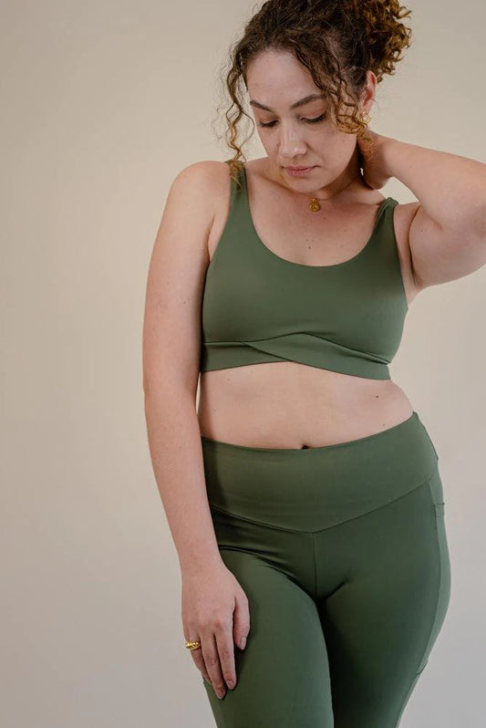 The bra's sexy V-back design will captivate you, while the crossover fabric with enclosed elastic at the front enhances this activewear masterpiece's versatility and comfort. High-quality stitching ensures durability, whether you're crushing your gym goals, perfecting your yoga poses, or rocking a casual street look, the Jungle Green Bruna Sports Bra is your trusted companion.