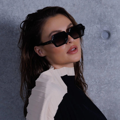 Liberty - A mid-sized, versatile frame with metal trim and a thick, flat face.
