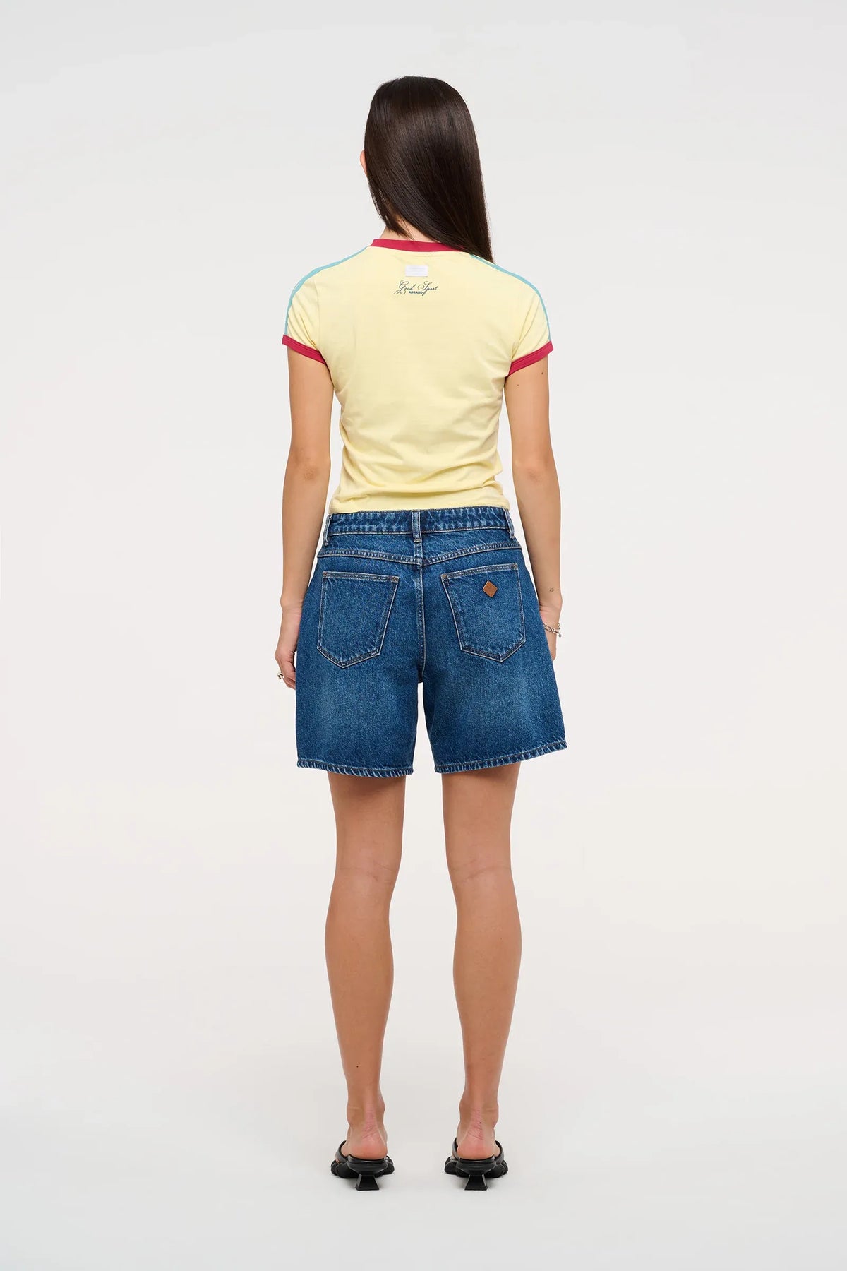 The '95 Relaxed Short by Abrand delivers effortless style with a mid-rise fit and generous 17cm in the leg. A comfortable wide leg opening and classic 5-pocket design provide everyday versatility. Mid-indigo wash with softened whisker details creates that lived-in aesthetic, while bright copper and silver trims and a tan dice patch add character. Crafted from a sustainable 50% Cotton and 50% Recycled Cotton blend, it's comfort and conscience combined.