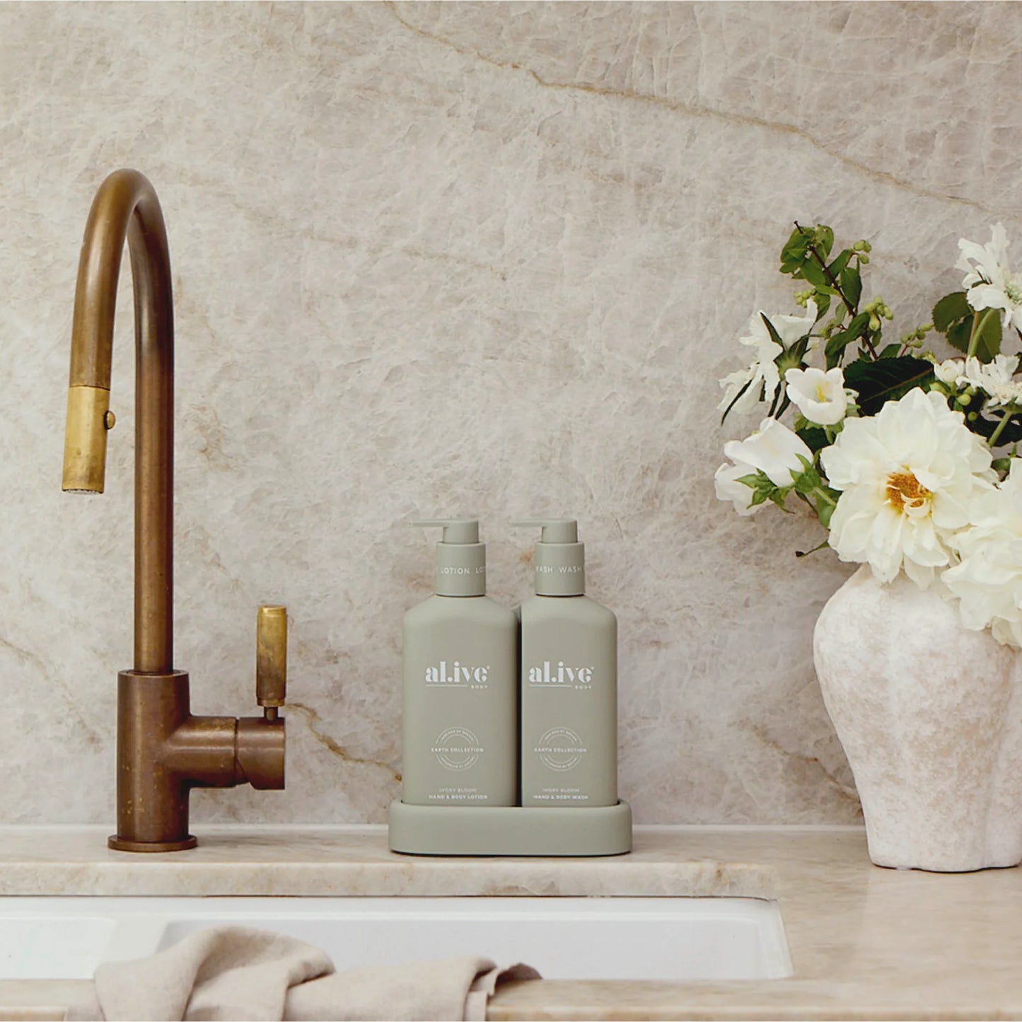 A limited-edition Compact Bathroom Duo, pairing a 300ml Hand &amp; Body Wash and 300ml Hand &amp; Body Lotion in a slimline, interlocking design, created for a more space-conscious bathroom setup. Scented in Ivory Bloom, a soft white floral fragrance, it brings a calm, considered feel to everyday routines.