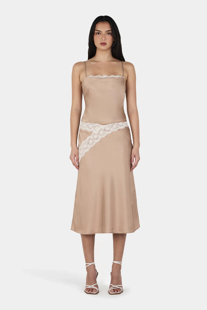 Soft, silky, and a little bit romantic. This is the skirt that instantly elevates your whole look.

Meet the Ownley Deja Midi Skirt, a bias-cut satin dream designed to glide with you from day to night. Falling gracefully below the knee, it creates that effortlessly flattering silhouette that feels polished without ever trying too hard.