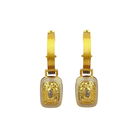 The&nbsp;Mara's are the epitome of classic style with a fabulous yet playful twist.&nbsp;They're beautiful, chic, and oh-so sassy… Crafted on a chunky fluted hoop, they feature a unique rectangle motif drop, combine with hammered gold texture,&nbsp;pearlescent enamel&nbsp;and eye-catching&nbsp;faceted Crystal Quartz&nbsp;gemstones. The Mara Earrings&nbsp;can be worn from day to night, with dazzling yet sophisticated flair that’s sure to turn heads. Enjoy the perfect balance of classic yet flirty with these 