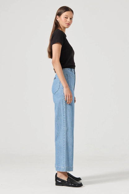 The Sailor Jean:
High rise, slim fit with a sailor wide leg
Fits smaller in the waist to eliminate gaps at the back waistband
Features Rolla's signature back pockets &amp; sailor style patch front pockets
Specially angled and shaped in the back for a truly peachy looking butt
Ankle length, also available in a long length
Zip closure
Made with vintage gold toned hardware