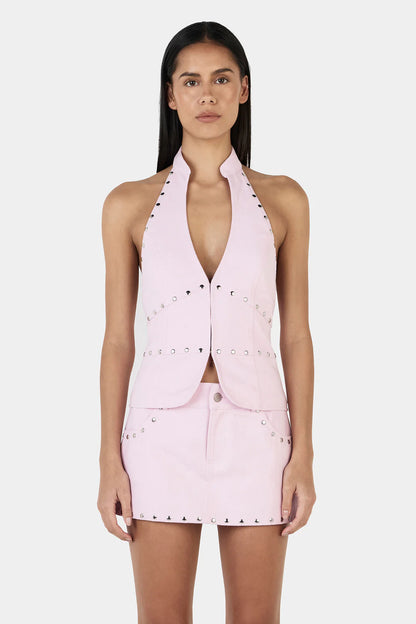 Make a Statement, Turn Every Head

Step out in the Selma Studded Top, Ownley’s bold halter vest designed for maximum impact. Featuring a plunging neckline, silver stud detailing, and a sleek backless design, this structured top adds an edgy, fashion-forward edge to any outfit. The hook-and-eye closure at the center front keeps it secure, while its versatile style lets you rock it solo or pair it with the matching Nikita Studded Skort for a head-turning, coordinated look.