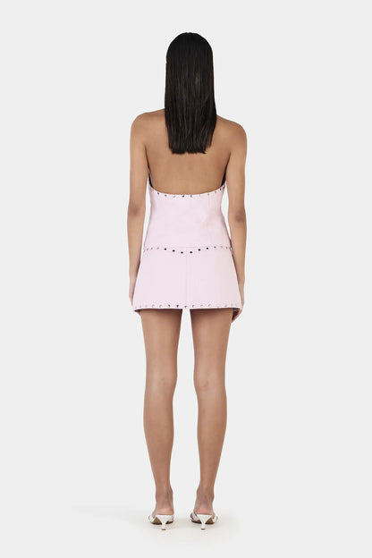 Make a Statement, Turn Every Head

Step out in the Selma Studded Top, Ownley’s bold halter vest designed for maximum impact. Featuring a plunging neckline, silver stud detailing, and a sleek backless design, this structured top adds an edgy, fashion-forward edge to any outfit. The hook-and-eye closure at the center front keeps it secure, while its versatile style lets you rock it solo or pair it with the matching Nikita Studded Skort for a head-turning, coordinated look.