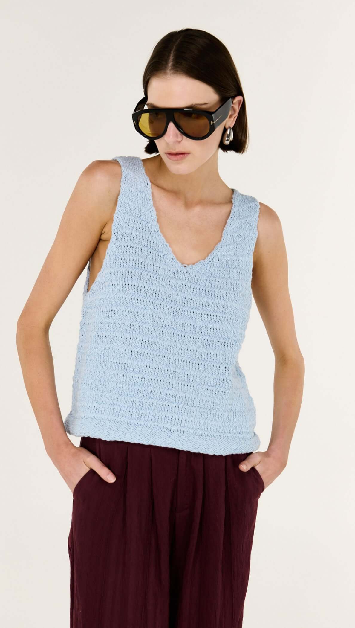 Effortless Layers, Endless Style.

Meet the Indie Baby Blue Cotton Knit Tank from Staple The Label, your new go-to for breezy, modern warm-weather dressing. Crafted in a softly textured knit, this sleeveless tank drapes beautifully over the body with a relaxed silhouette that feels easy yet polished.