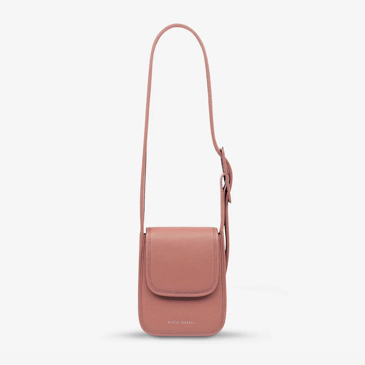Knowing her mind, 'Perplex' has places to go and people to see. With a more structured body, leather wrapped buckle, back slider pocket for your phone and snap magnet closure, Perplex comfortably hugs your body and is ready for your next day or night adventure.