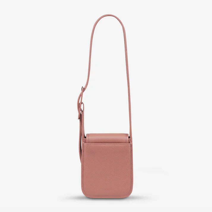 Knowing her mind, 'Perplex' has places to go and people to see. With a more structured body, leather wrapped buckle, back slider pocket for your phone and snap magnet closure, Perplex comfortably hugs your body and is ready for your next day or night adventure.