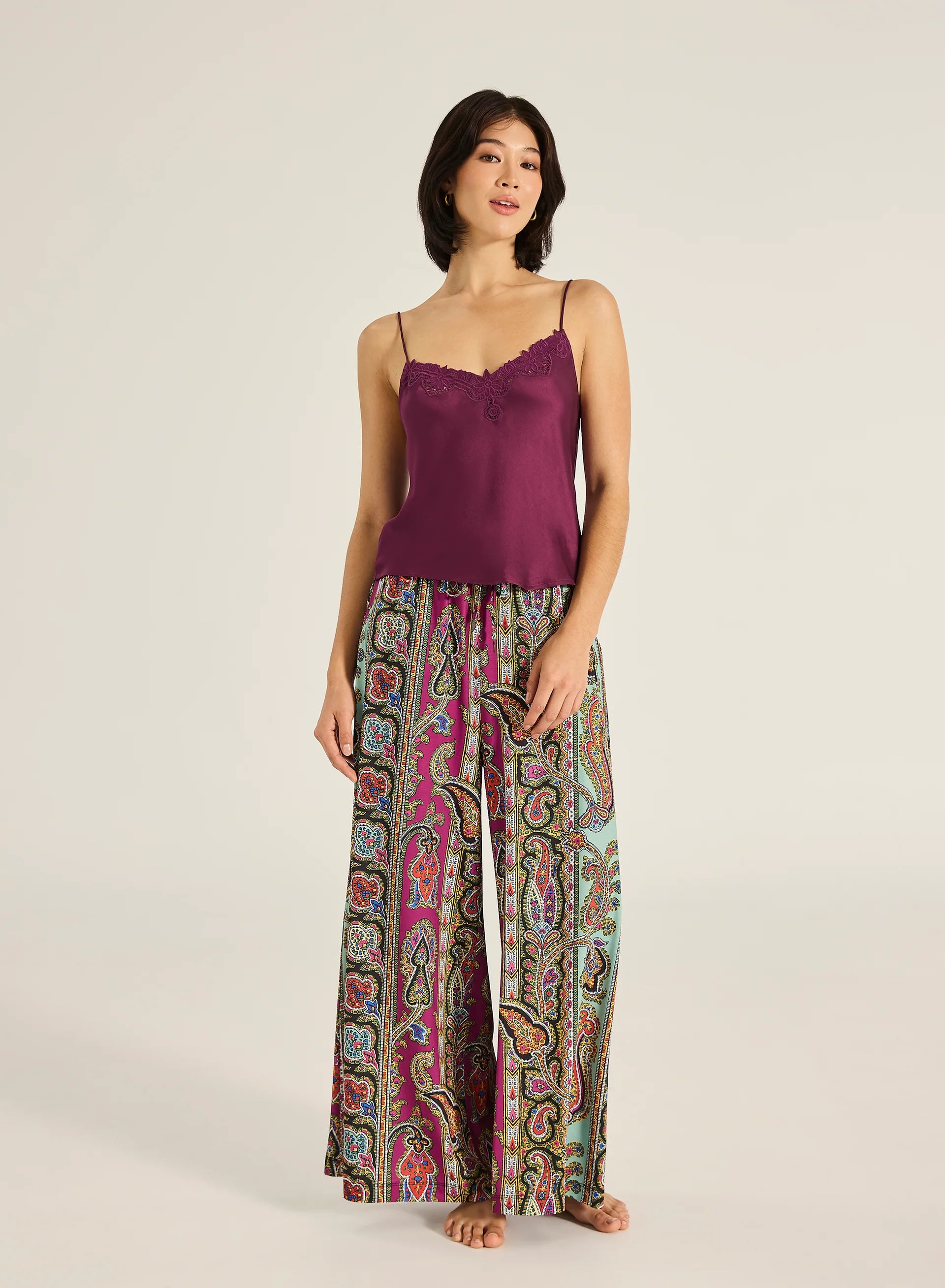 Meet the Kit Cami—an effortlessly elegant piece crafted with a soft V neckline, adjustable straps, and intricate embroidered detailing. Designed to drape beautifully with a luxurious hand feel, it brings a touch of timeless sophistication to any outfit. Pair with shorts or a floaty skirt for an ensemble that works from day to night.