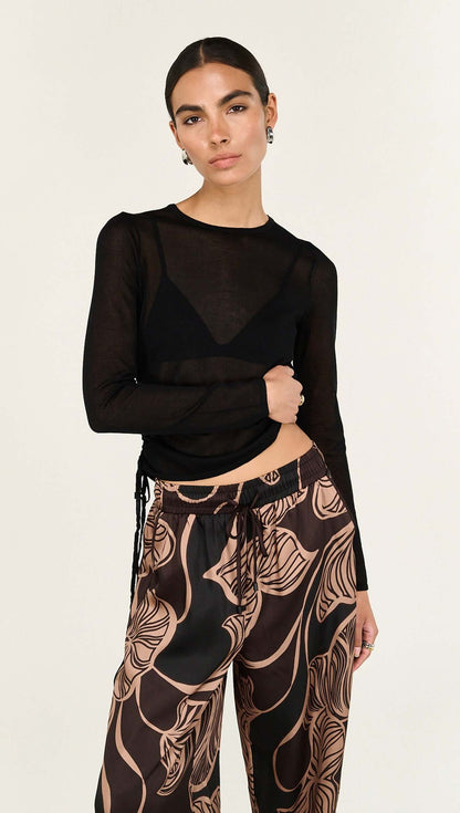 The Abstract Leaf Print Relaxed Silky Pants are designed for effortless, elevated dressing with a statement edge. 