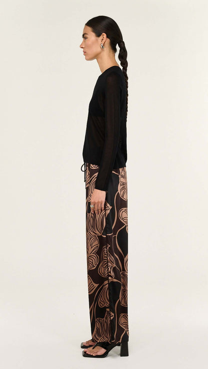 The Abstract Leaf Print Relaxed Silky Pants are designed for effortless, elevated dressing with a statement edge. 