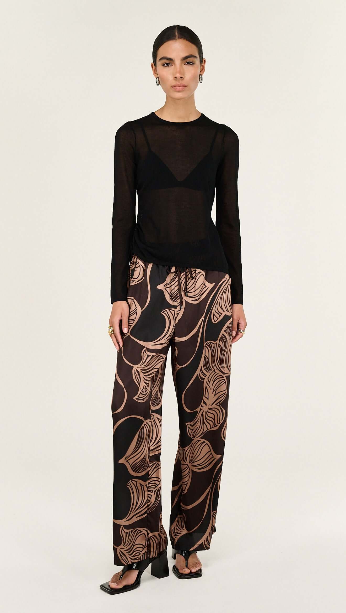 The Abstract Leaf Print Relaxed Silky Pants are designed for effortless, elevated dressing with a statement edge. 