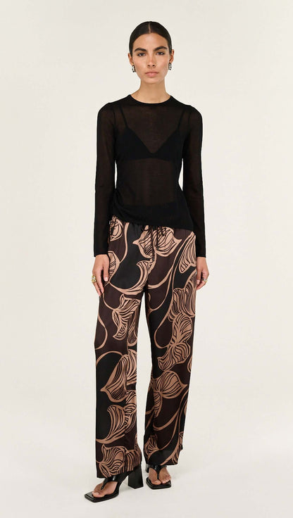The Abstract Leaf Print Relaxed Silky Pants are designed for effortless, elevated dressing with a statement edge. 