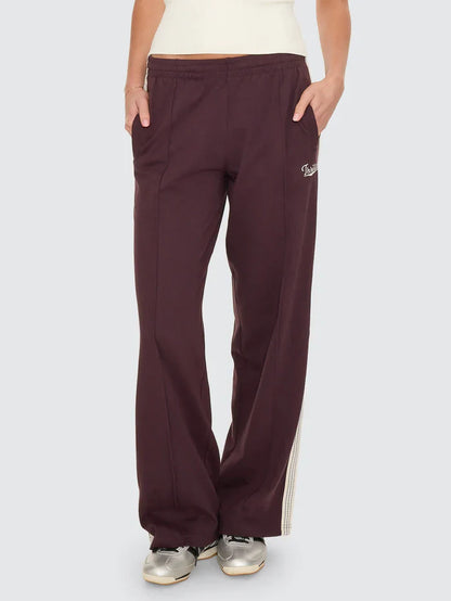 Thrills Off Track Pant

Made for comfort you'll want to wear over and over, the Off Track Pant in Aubergine is an all-around favourite from our winter streetwear Australia collection. Sitting high on the waist, this elevated track pant keeps things clean with pintuck pleats down the leg and webbing tape running along the outer seams for a subtle sport edge. The loop-back cotton feels soft but substantial, while zip pockets, an elastic waist, and an internal drawcord keep it easy to wear. 