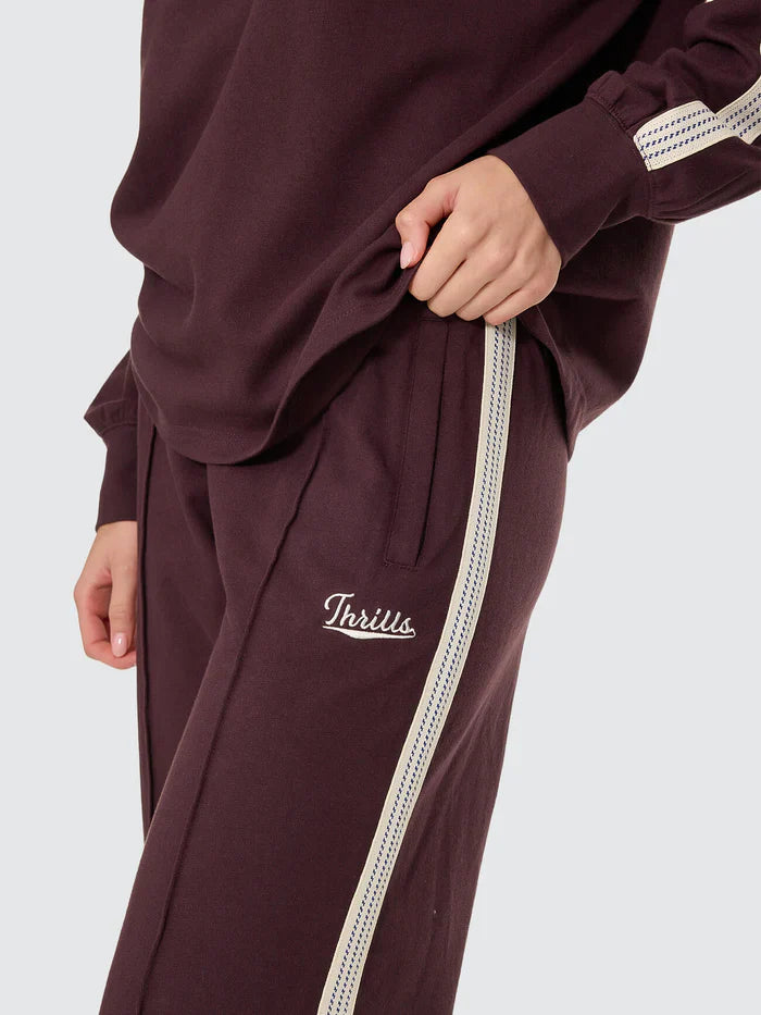 Thrills Off Track Pant
Made for comfort you'll want to wear over and over, the Off Track Pant in Aubergine is an all-around favourite from our winter streetwear Australia collection. Sitting high on the waist, this elevated track pant keeps things clean with pintuck pleats down the leg and webbing tape running along the outer seams for a subtle sport edge. The loop-back cotton feels soft but substantial, while zip pockets, an elastic waist, and an internal drawcord keep it easy to wear. 