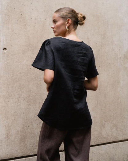 Chic, Effortless, and Ready to Wear

Meet the Delight Top – Black by White Closet, your go-to for laid-back elegance with a modern twist. Crafted from breathable linen, this top keeps you cool and comfy while looking effortlessly polished. The floaty sleeves and relaxed silhouette create an easy, airy vibe, while the front tie-up detail adds a subtle, feminine touch that’s perfectly sophisticated.