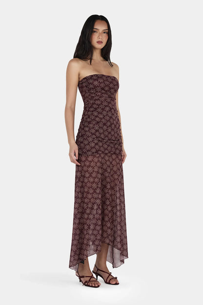 Soft, flirty, and made to move with you. This is your “main character energy” dress.

Meet the Ownley Zella Midi Dress – Daisy Dot Cherry Choc, a strapless silhouette that blends romance and ease in the most effortless way. Designed in a dreamy cherry-chocolate daisy dot mesh, it brings a playful yet elevated vibe that feels perfect for dinners, events, or those nights where you just want to feel a little extra.