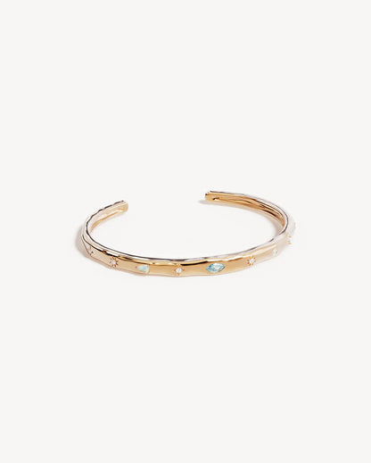 Breathe new life into the new year with the&nbsp;Hope and Protection Cuff. Set with&nbsp;cubic&nbsp;zirconias&nbsp;and lab-grown opals, our luminous evil eye will&nbsp;assist&nbsp;you in shedding all that does not serve you, allowing you to move into the new year with purpose and peace. This keepsake is perfect for gifting, traditionally gifted to imbue the wearer with luck and protection.&nbsp;