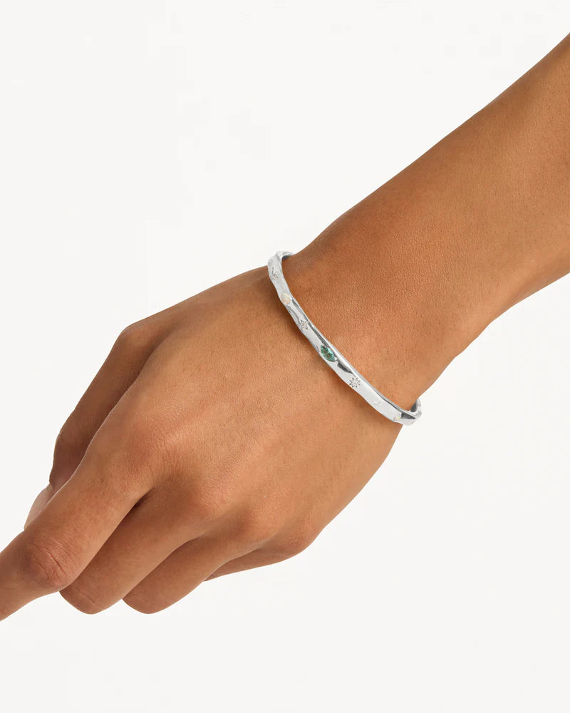 Breathe new life into the new year with the&nbsp;Hope and Protection Cuff.&nbsp;Set with&nbsp;cubic&nbsp;zirconias&nbsp;and lab-grown opals, our luminous evil eye will&nbsp;assist&nbsp;you in shedding all that does not serve you, allowing you to move into the new year with purpose and peace. This keepsake is perfect for gifting, traditionally gifted to imbue the wearer with luck and protection.&nbsp;