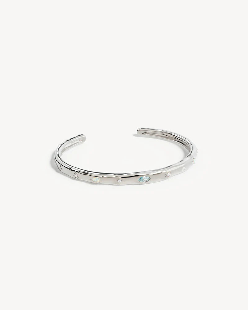 Breathe new life into the new year with the&nbsp;Hope and Protection Cuff.&nbsp;Set with&nbsp;cubic&nbsp;zirconias&nbsp;and lab-grown opals, our luminous evil eye will&nbsp;assist&nbsp;you in shedding all that does not serve you, allowing you to move into the new year with purpose and peace. This keepsake is perfect for gifting, traditionally gifted to imbue the wearer with luck and protection.&nbsp;