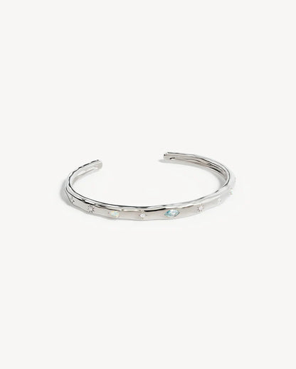 Breathe new life into the new year with the&nbsp;Hope and Protection Cuff.&nbsp;Set with&nbsp;cubic&nbsp;zirconias&nbsp;and lab-grown opals, our luminous evil eye will&nbsp;assist&nbsp;you in shedding all that does not serve you, allowing you to move into the new year with purpose and peace. This keepsake is perfect for gifting, traditionally gifted to imbue the wearer with luck and protection.&nbsp;