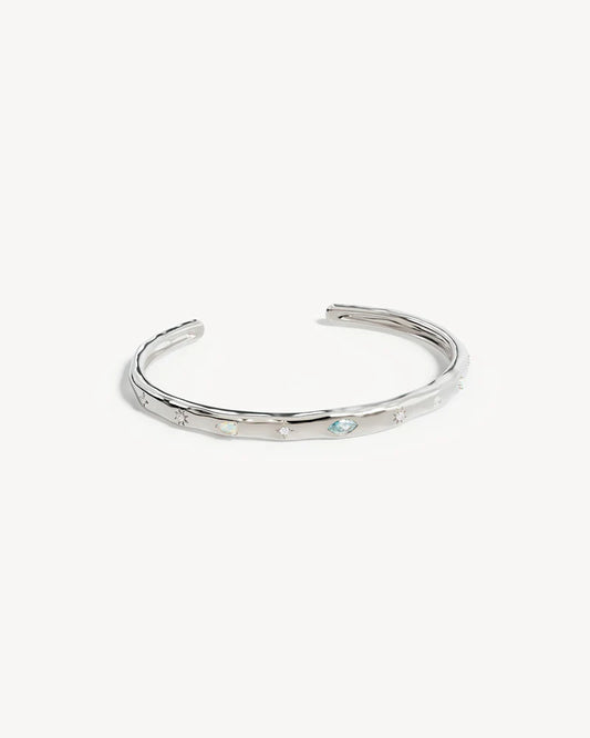 Breathe new life into the new year with the&nbsp;Hope and Protection Cuff.&nbsp;Set with&nbsp;cubic&nbsp;zirconias&nbsp;and lab-grown opals, our luminous evil eye will&nbsp;assist&nbsp;you in shedding all that does not serve you, allowing you to move into the new year with purpose and peace. This keepsake is perfect for gifting, traditionally gifted to imbue the wearer with luck and protection.&nbsp;