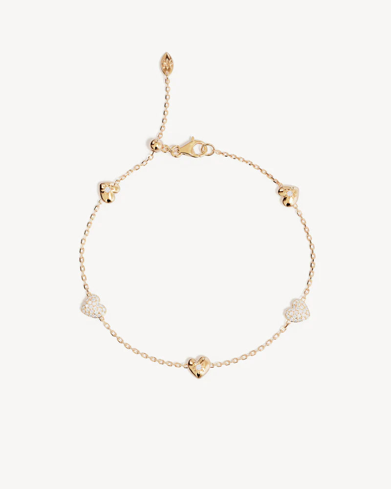 The You Have My Heart Charm Bracelet is a joyful and sparkling proclamation of love and connection, re-imagining the heart motif into a playful charm design featuring alternating crystal encrusted pendants. Wear this design as a reminder of the love that surrounds, enriches, and strengthens you every day. &nbsp;

18k Gold Vermeil: 2.5 microns of 18 carat gold coating a sterling silver base.&nbsp;

Features sparkling cubic zirconias in claw and pavé settings.&nbsp;

Bracelet length: 19cm.&nbsp;

Features a s