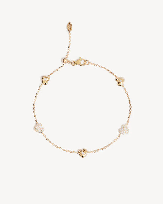 The You Have My Heart Charm Bracelet is a joyful and sparkling proclamation of love and connection, re-imagining the heart motif into a playful charm design featuring alternating crystal encrusted pendants. Wear this design as a reminder of the love that surrounds, enriches, and strengthens you every day. &nbsp;

18k Gold Vermeil: 2.5 microns of 18 carat gold coating a sterling silver base.&nbsp;

Features sparkling cubic zirconias in claw and pavé settings.&nbsp;

Bracelet length: 19cm.&nbsp;

Features a s