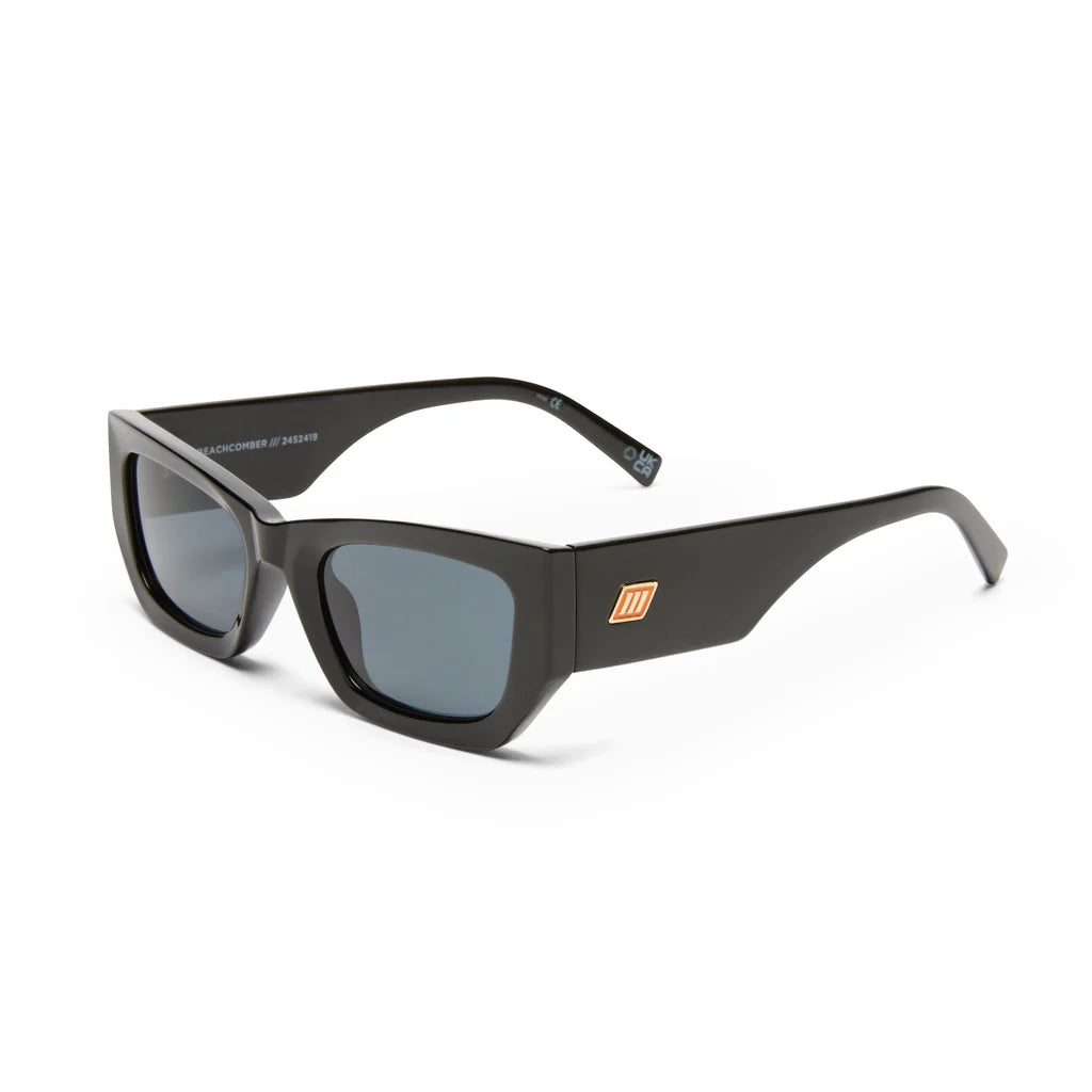 Timelessly elegant and sophisticated, our BEACHCOMBER sunglasses are an everyday staple. Featuring a low bridge fit, bold edges and bevelled lines, this frame is finished with a square flagstripe hardware with custom enamel fill to each temple.

• Finished in shiny black with bright gold hardware and dark tonal lenses for a sleek look.
• Made using BPA free polymer plastic which is lightweight, durable and impact resistant
• Fitted with shatterproof and scratch resistant polycarbonate lenses.