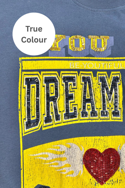 Go big, dream louder. This tee’s not here to play small.

Big vibes, bold energy. The Very Oversized Dream Big Beaded Tee by Sabbi is made for those who dream loud, live freely, and never wait for permission. With our signature very oversized silhouette, it’s all about effortless comfort, relaxed proportions, and graphics that stand out.

The varsity-inspired Dream Big Sabbi front print pops with beaded detailing, while the striking Be Fearless 71 statement on the back channels vintage sports energy with a 