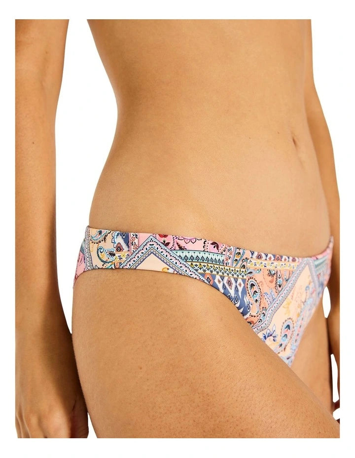 Solara Tiger Bikini Bottom -Tigerlily

Dive into sunny days with the Solara Tiger Bikini Bottom. This classic bikini bottom is all about flattering mid coverage and a versatile design that lets you express your style. Wear it low on the hips for a relaxed, modest look, or pull it up higher on the waist to create a stunning, leg-lengthening silhouette with a modern edge. However you wear it, you'll feel confident and ready for the water.

Features:

Classic leg line
Mid coverage
Signature Tigerlily meta