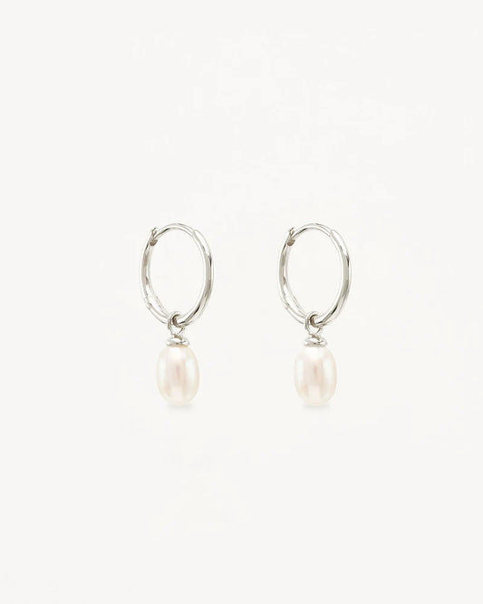 Find inner peace, balance and tranquillity with our&nbsp;Silver&nbsp;Live in Peace Hoops. This elevated take on the classic pearl earring is designed to inspire optimism and stillness, even amidst chaos.