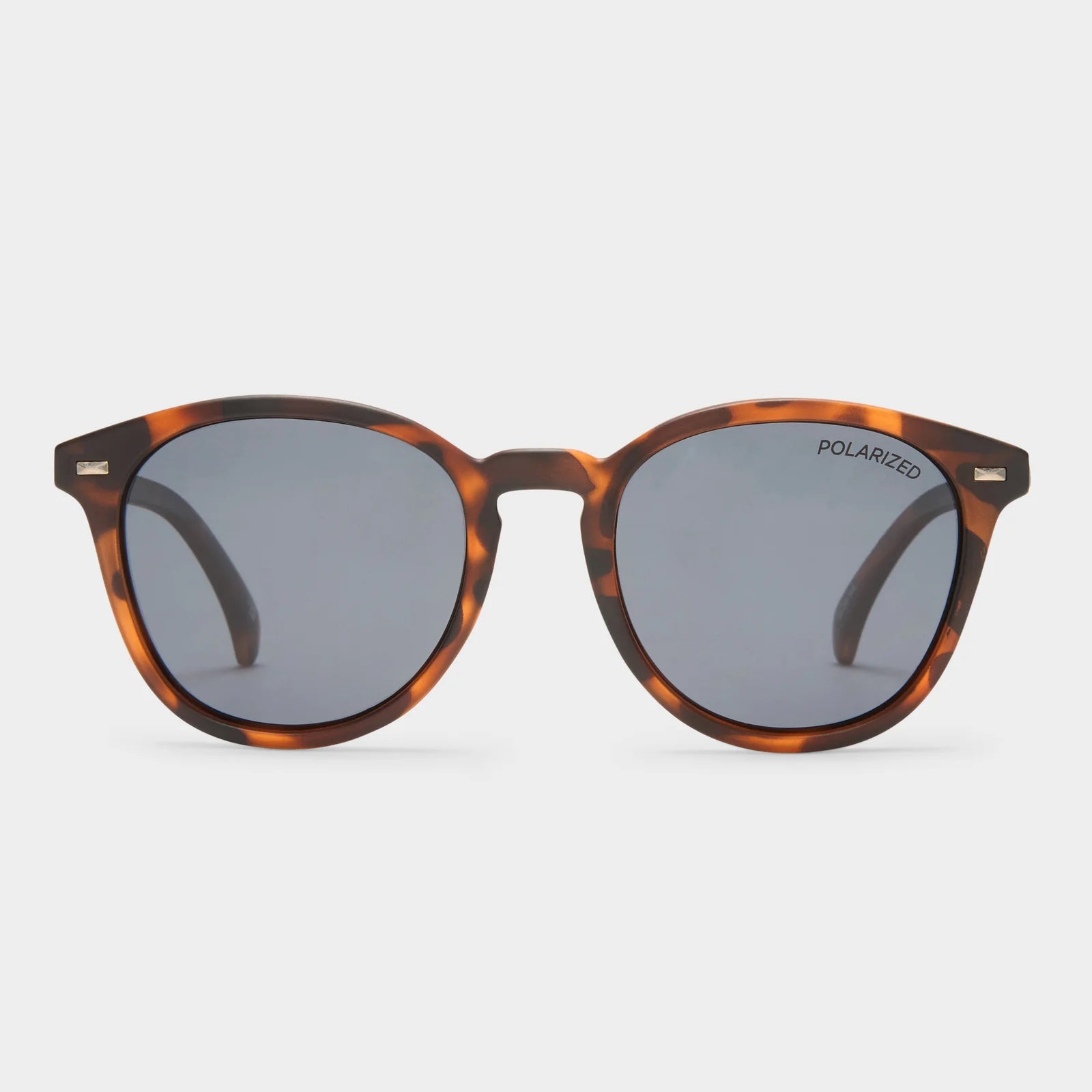 With vintage inspired details, our iconic BANDWAGON frame is the perfect all-round sunglass offering a timeless aesthetic. Featuring a keyhole nose bridge and refined angles, this midsize style is finished with discreet metal rivet detailing and Le Specs flagstripe metal hardware.

• Finished in a matte tort frame paired with dark smoke mono lenses.
• A lightweight, durable and impact resistant polycarbonate frame.
• Fitted with polarized lenses to eliminate unwanted reflective glare.