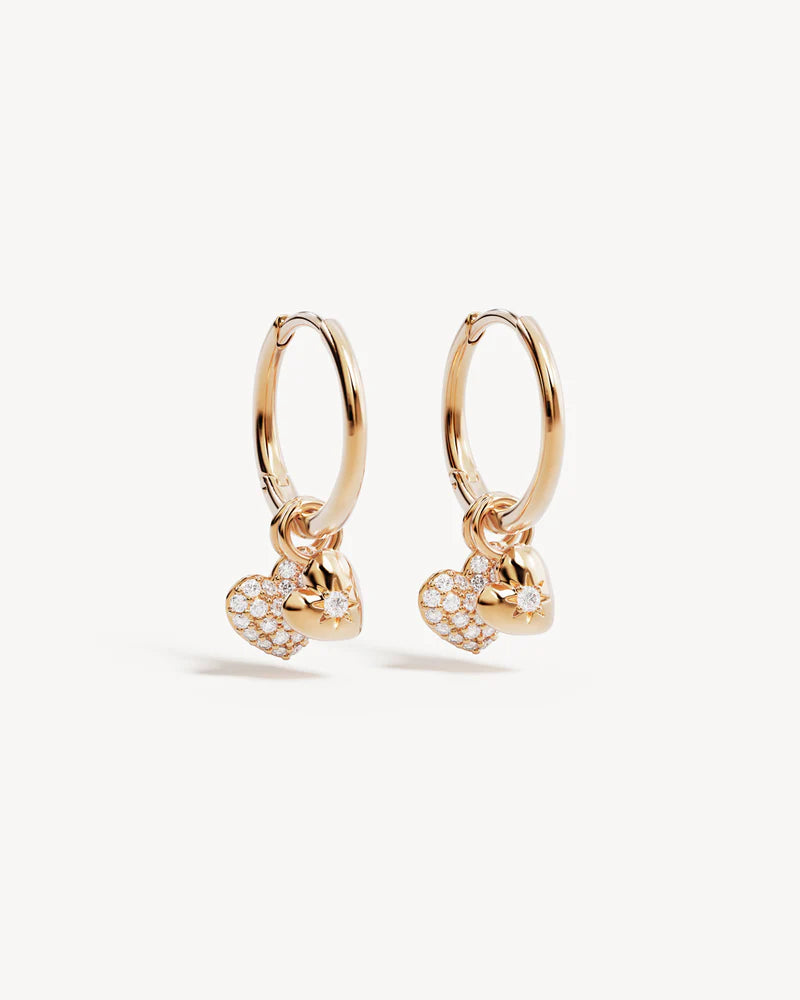 By Charlotte - The You Have My Heart Hoops is a joyful and sparkling proclamation of love and connection, re-imagining the heart motif into a playful charm design featuring alternating crystal encrusted pendants. Wear this design as a reminder of the love that surrounds, enriches, and strengthens you every day.&nbsp;

18k Gold Vermeil: 2.5 microns of 18 carat gold coating a sterling silver base.&nbsp;

Pendants are removable.&nbsp;

Set with cubic zirconias in claw and pavé settings.&nbsp;

Sold as a pair.&