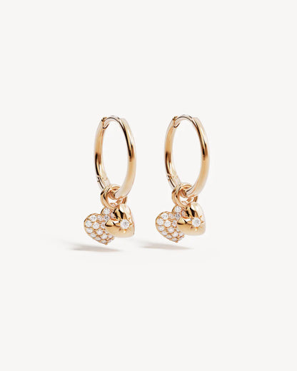 By Charlotte - The You Have My Heart Hoops is a joyful and sparkling proclamation of love and connection, re-imagining the heart motif into a playful charm design featuring alternating crystal encrusted pendants. Wear this design as a reminder of the love that surrounds, enriches, and strengthens you every day.&nbsp;

18k Gold Vermeil: 2.5 microns of 18 carat gold coating a sterling silver base.&nbsp;

Pendants are removable.&nbsp;

Set with cubic zirconias in claw and pavé settings.&nbsp;

Sold as a pair.&