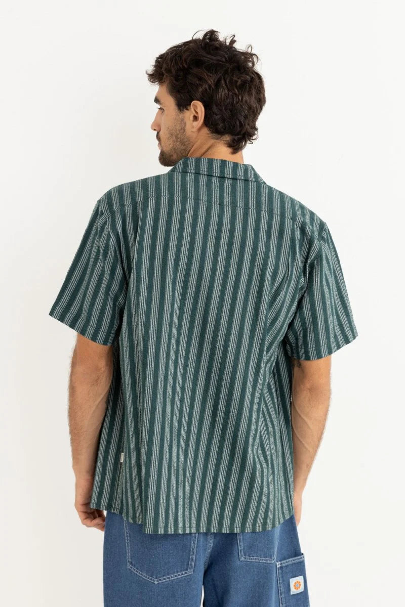 The Eli Stripe SS Shirt in Teal offers classic design with a modern twist. Featuring a one-piece collar, button-front closure, and a chest pocket, this shirt’s straight hem makes it an easy-wearing staple for warmer days.
