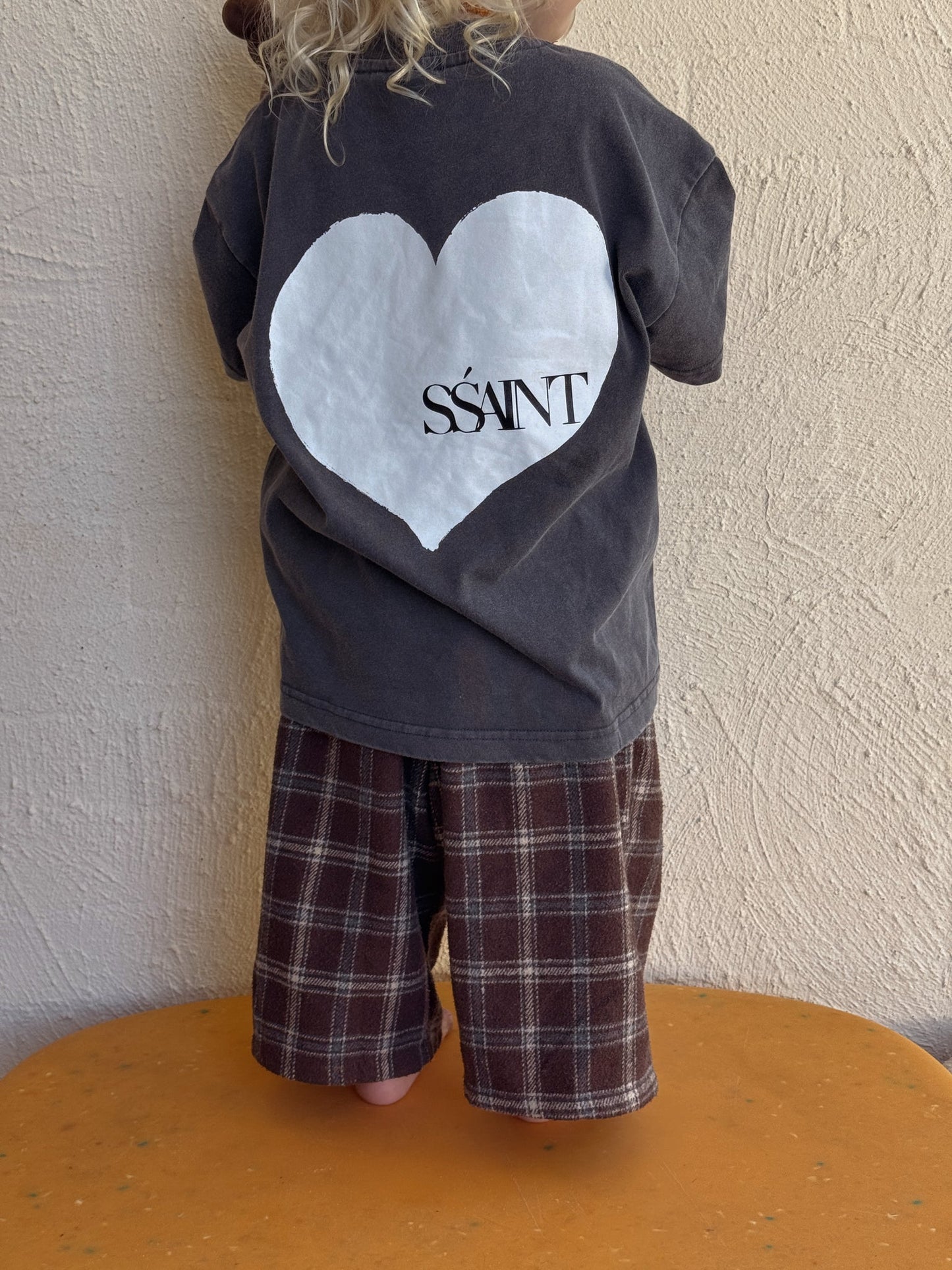 Kids' SSaint Heart Tee in Acid Wash Charcoal

A little heart on the front, a whole lot of love on the back. This unisex tee is perfect for the little lovers of the world. Made from 100% cotton with a relaxed fit, it’s designed for effortless comfort and style. Match with your mini and pair it back with our SŚAINT No Vacancy Tee for a coordinated look.