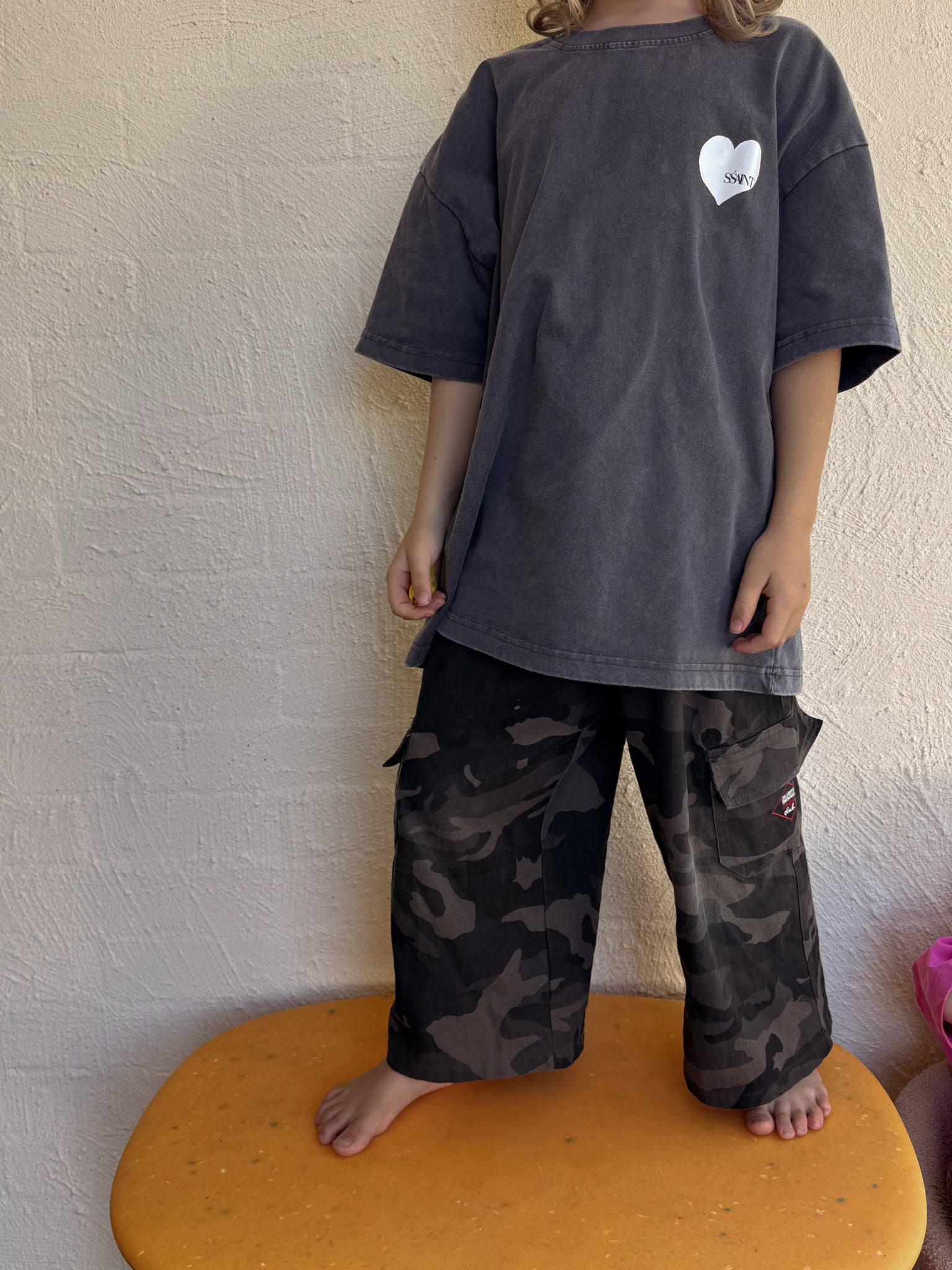 Kids' SSaint Heart Tee in Acid Wash Charcoal

A little heart on the front, a whole lot of love on the back. This unisex tee is perfect for the little lovers of the world. Made from 100% cotton with a relaxed fit, it’s designed for effortless comfort and style. Match with your mini and pair it back with our SŚAINT No Vacancy Tee for a coordinated look.