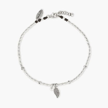 Embark on a dreamy island adventure with our Island Dreaming Anklet. Handcrafted with love, this anklet features Hill Tribe Silver beads and charms that exude bohemian charm and coastal elegance. The Polywax cotton cord adds a touch of natural texture, while the Sterling Silver clasp and adjustable link ensure a secure and comfortable fit. Let the Island Dreaming Anklet be a reminder of carefree days and the beauty of island living.